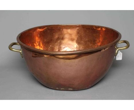 A VICTORIAN COPPER AND BRASS BASIN of two handled deep circular form, 9 3/4" high, 21 3/4" diameter (Est. plus 24% premium in