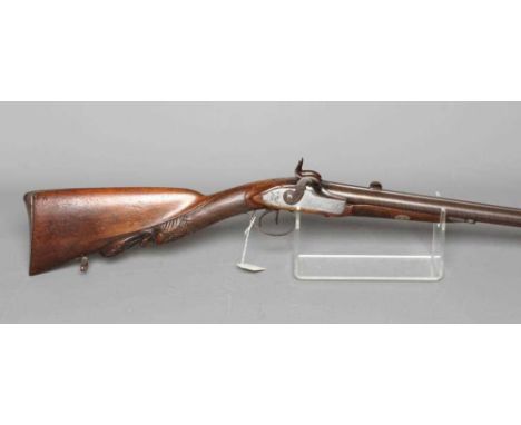 A PERCUSSION DOUBLE BARELLED RIFLE with 31 3/4" damascus barrels, front bead sight, rear dangerous game(?) sight, floral and 