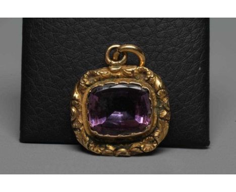 A VICTORIAN AMETHYST PENDANT, the facet cut cushion shaped stone collet set in a foliate carved unmarked mount (Est. plus 24%