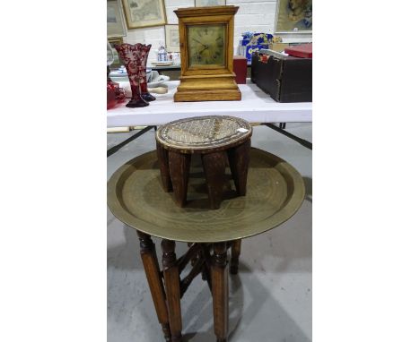 An oak cased mantel clock with German gong-striking movement and pendulum, 30cm high, a wooden tribal stool, 17.5cm high, (af