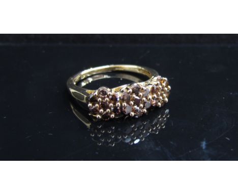 A 9ct gold ring with three floral champagne diamond clusters. Size N/O, 3g with certificate    