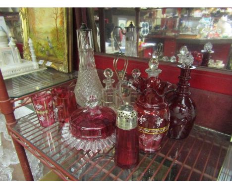 A quantity of cranberry and ruby glass wares including jug and decanter