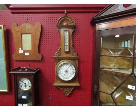 A late Victorian oak aneroid barometer with thermometer, dial signed F. Sharman, Optician, Wellingborough, 78cm high