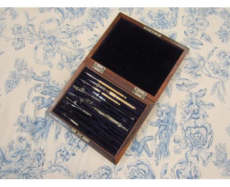 An early 20th Century walnut geometry set