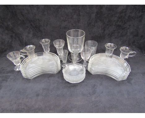 A quantity of table glass including measuring glasses, custard cups, jelly glasses, a set of twelve glass side/salad plates a