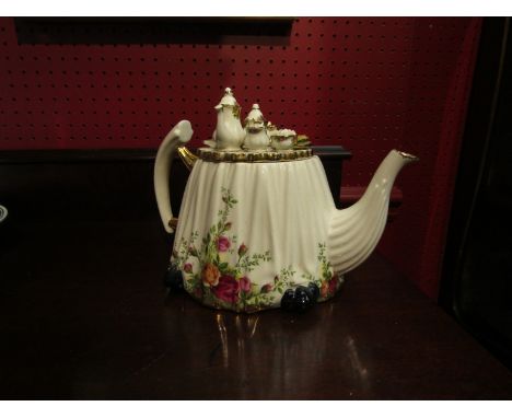 A Royal Albert 'Old Country Roses' teapot with decorative lid