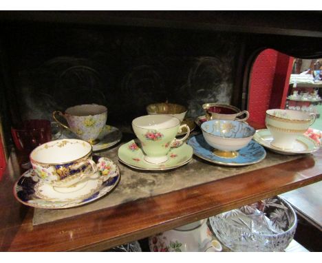 Seven pairs of cabinet cups and saucers and a glass custard cup