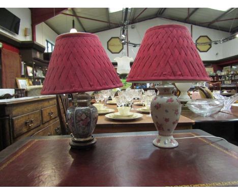 Two ceramic lamps with red pleated shades