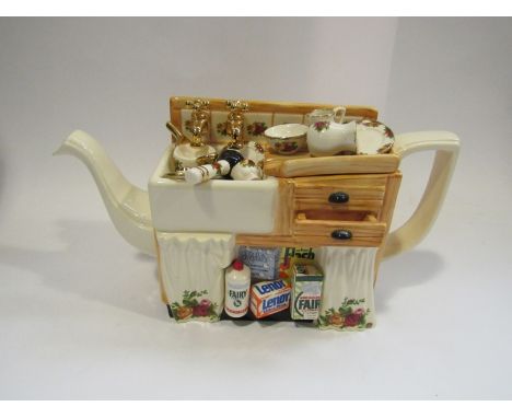 A Royal Albert 'Old Country Roses' teapot as a kitchen sink cupboard 