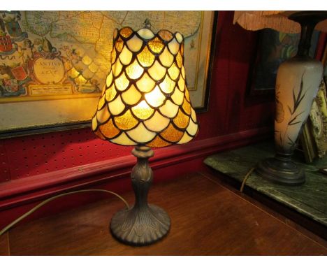 A Tiffany style table lamp with amber and cream shade 