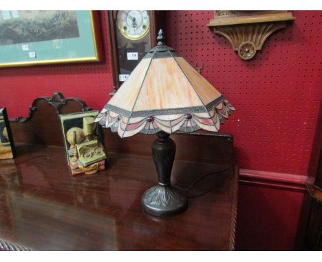 A Tiffany style table lamp with peach coloured shade