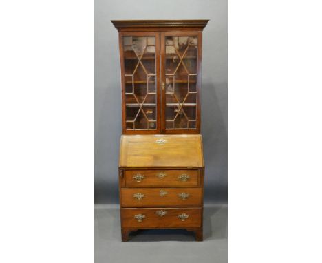 A 19th Century Mahogany Bureau Bookcase, the moulded cornice above two astragal glazed doors enclosing shelves, the lower sec
