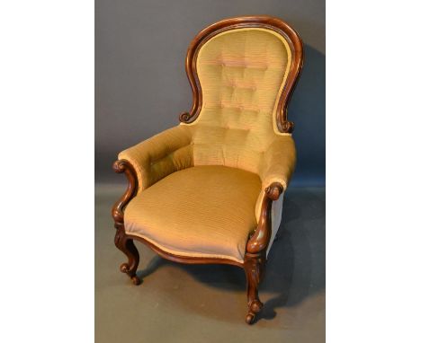 A Victorian Mahogany Spoonback Drawing Room Armchair, the button upholstered back above a stuff over seat with scroll arms, r
