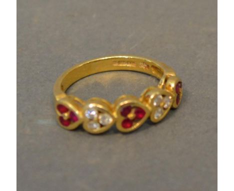 An 18ct. Gold Ruby And Diamond Ring Of Heart Form 