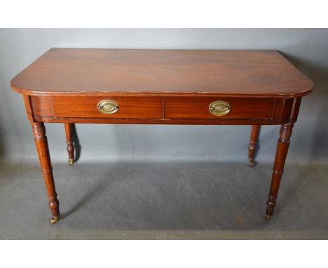 An Early 19th Century Mahogany Console Table, the reeded top above two frieze drawers with oval brass handles, raised upon ri