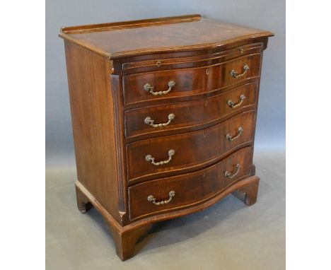 A 20th Century Mahogany Serpentine Chest, the moulded top above a brushing slide and four long drawers with brass handles, ra