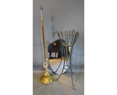 A Brass Lamp Standard together with a patinated metal Jardiniere and a shield shaped Wall Mirror 