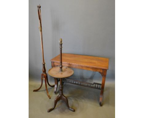 An Edwardian Rectangular Centre Table with Shaped Legs and Spindle Stretcher, together with a mahogany lamp table and an adju