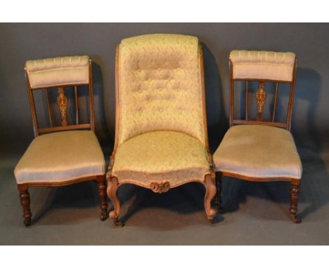 A Victorian Walnut Drawing Room Chair, with a button upholstered back above an over stuffed seat, raised upon cabriole legs w
