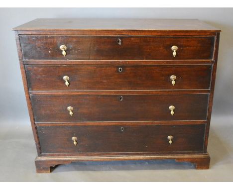A 19th Century Oak Chest of Four Long Drawers with Brass Drop Handles, raised upon bracket feet, 100 cms wide, 48 cms deep, 9