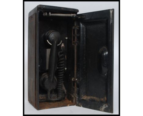 A vintage Railway trackside telephone, within the original cast iron cabinet case. H37cm