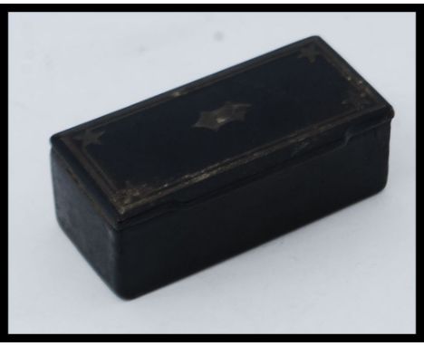 A 19th century papier mache snuff box of rectangular form with hinged lid being inlaid to the top. W6.5cm