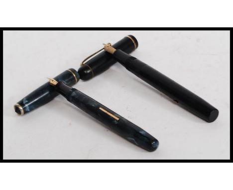 A vintage 20th century Boots ' Chatsworth ' ? lever fill fountain pen with 14ct gold nib. Set in faux marble cap and case wit