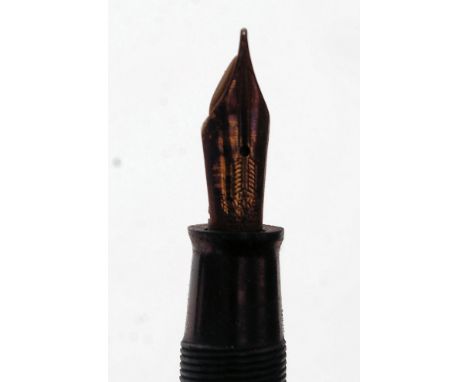 A 1936  Canadian striped gold Parker Vacumatic fountain pen with arrow parker nib. 

