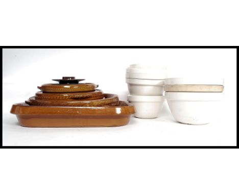 A collection of retro stoneware cooking pots along with a collection of ceramic cooking / pudding bowls