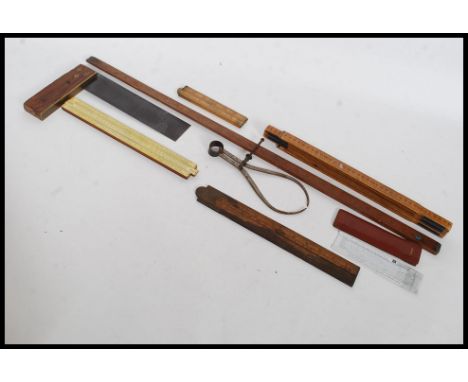 A collection of vintage measures to include slide rules, set squares etc please see images