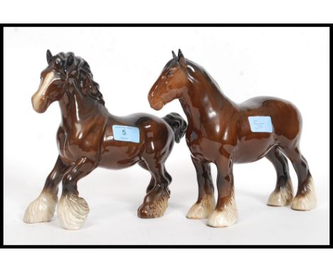 Two Beswick ceramic shire horse figurines each with a gloss brown finish bearing Beswick England marks to the base, one gallo