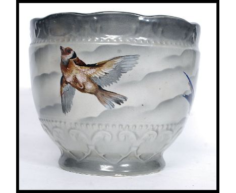 A decorative mid century Empire ware large Staffordshire ceramic planter being decorated with British Birds etc