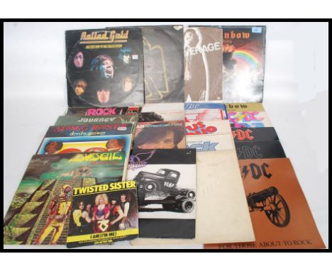 A collection of long play vinyl records of mainly rock artists to include AC / DC x 6 Rainbow x 2, Santana Aerosmith, Rolling