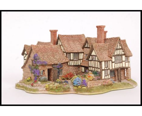 LILLIPUT LANE: An original Lilliput Lane ' The Almonry ' 119 ceramic cottage, within the original box, with deeds. 