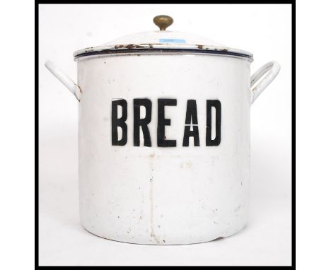 A vintage early 20th century enamel  round bread bin, with lid, marked ' Bread ' to front. H34cm . Complete with lid