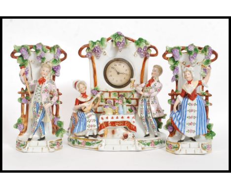 A 20th century Dresden style continental ceramic clock and garniture set. The central dial inset to decorative glazed case em