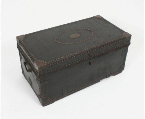 A 19th century Georgian leather bound trunk - chest. The chest with brass bindings and studded borders having carry handles t