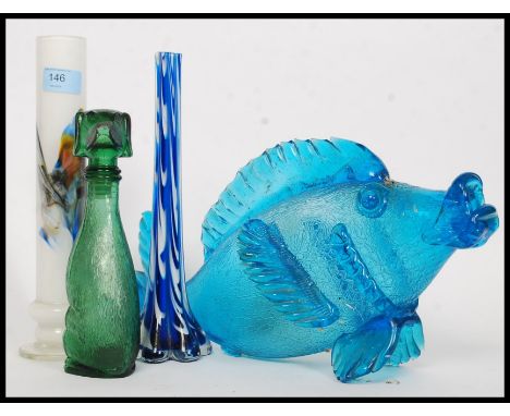A collection of studio glass to include a fish, vases and a dog shaped glass decanter. L46cm