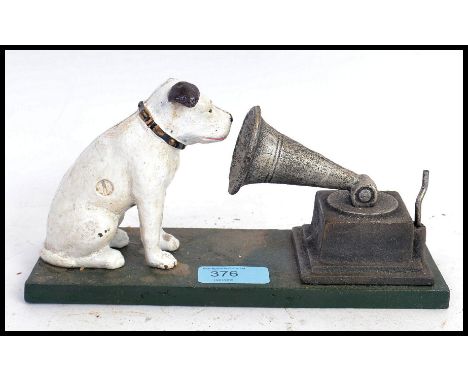 A vintage style cast iron hand painted HMV advertising figure, depicting a Nipper style dog next to a gramophone. 