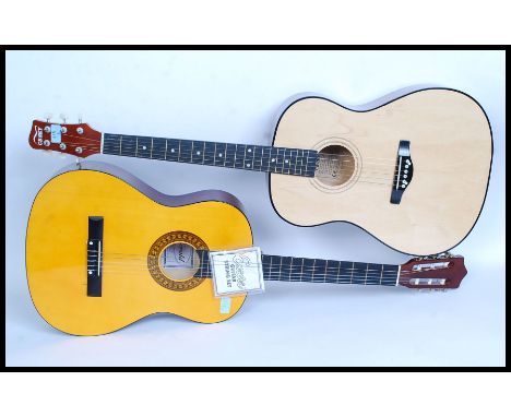 Two six string acoustic guitars, the first by CBSKY and the other by Herald