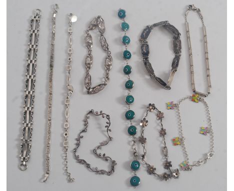 A collection of 10 ladies contemporary silver bracelets. To include enamel set, siam silver, kerb linked, fret worked, flower