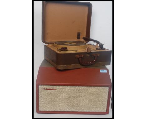 A vintage cased portable 1960's Defiant four speed two tone record player along with a portable Handy - Gram