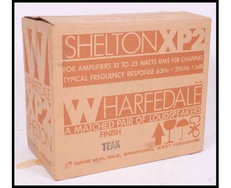 A pair of original vintage Wharfedale Shelton teak speakers being  complete in the original box.