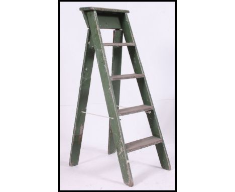 A painted mid century shabby chic Industrial step ladder in original green paint finish. H127 x W40 x D75cm