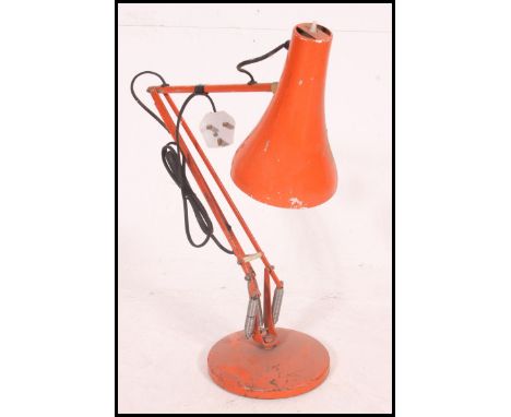 A retro 1970's Herbert Terry Industrial anglepoise desk lamp in orange with circular base and pendant shade