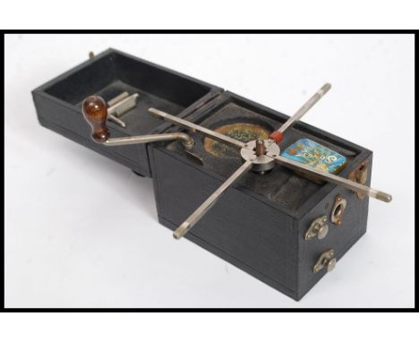 A vintage early 20th century Dixonia miniature portable gramaphone in black vinyl box case ( see illustrations )