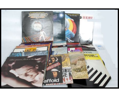 A collection of vinyl long play records from the 70's and 80's to include The Waterboys, Curvered Air, Fleetwood Mac, U2, Cat