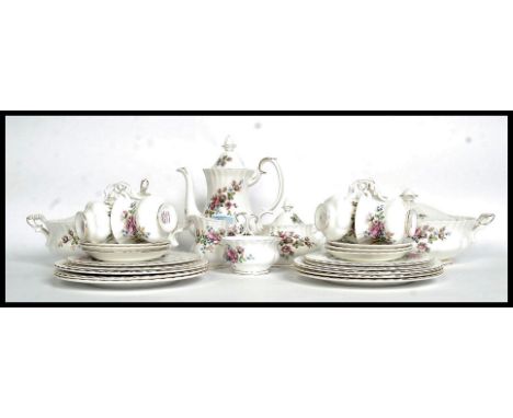 A Royal Albert ' Moss Rose ' chintz pattern Staffordshire china tea service. Comprising cups, teapot, plates, tureens etc