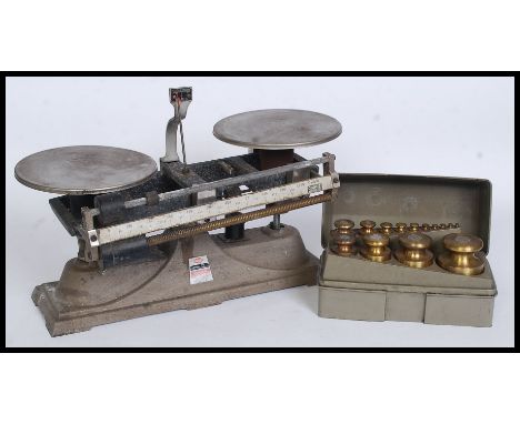 A vintage set of Ohaus Industrial Balance scales along with a case of brass Ohaus weights