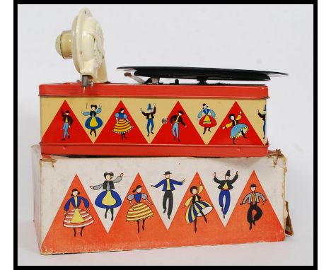 A 1950's tin plate Chad Valley Kiddies Toy Gramaphone - Made in England with the original box and key.  With records